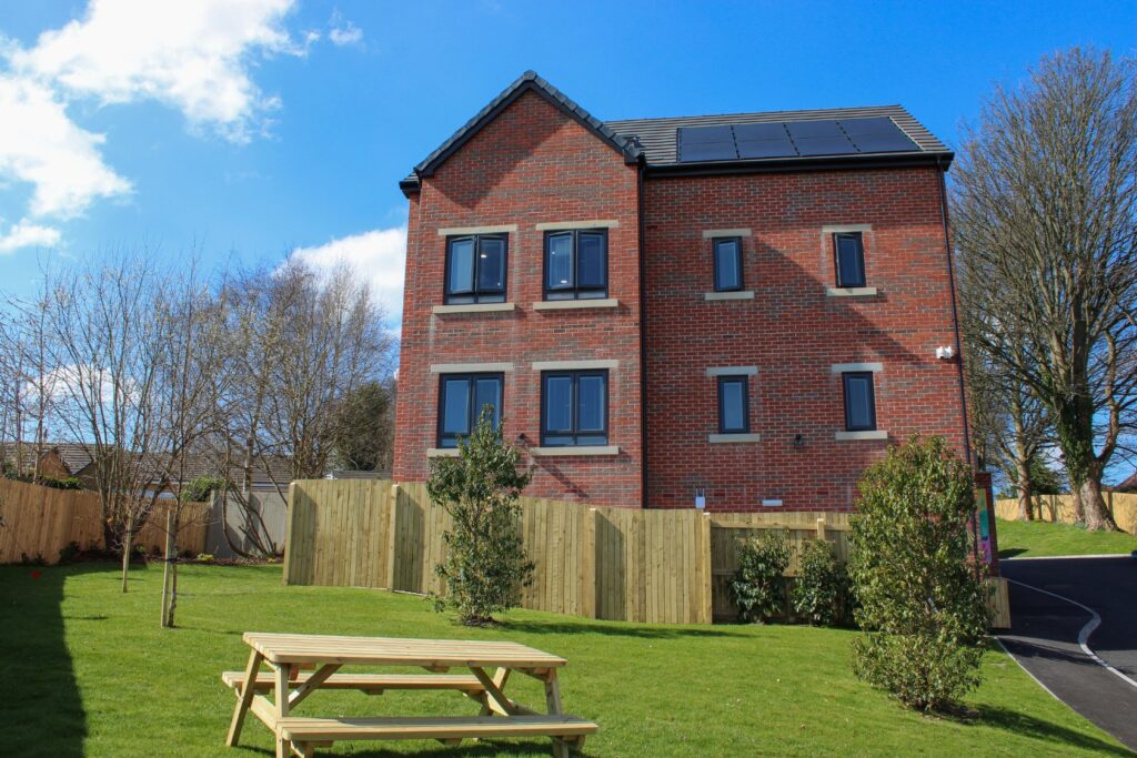 The Brambles Apartments building and garden in Rastrick, Brighouse